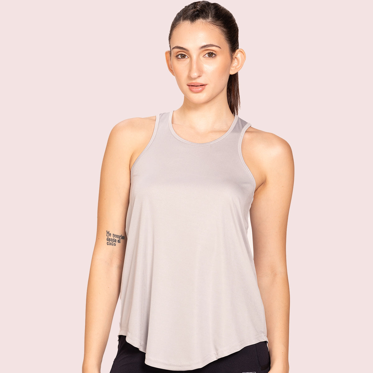 Grey activewear racerback tank top, front view on model — Munns & Mars