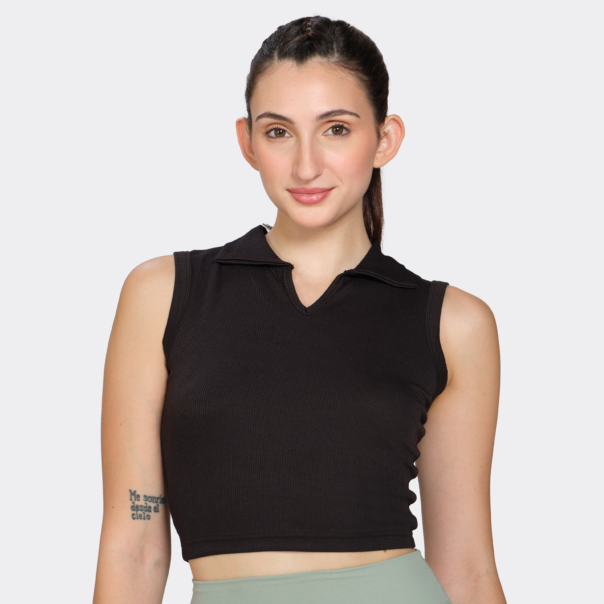 Black ribbed polo-neck tank top, front view on model — Munns & Mars