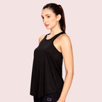 Black activewear racerback tank top, on model, front pose — Munns & Mars