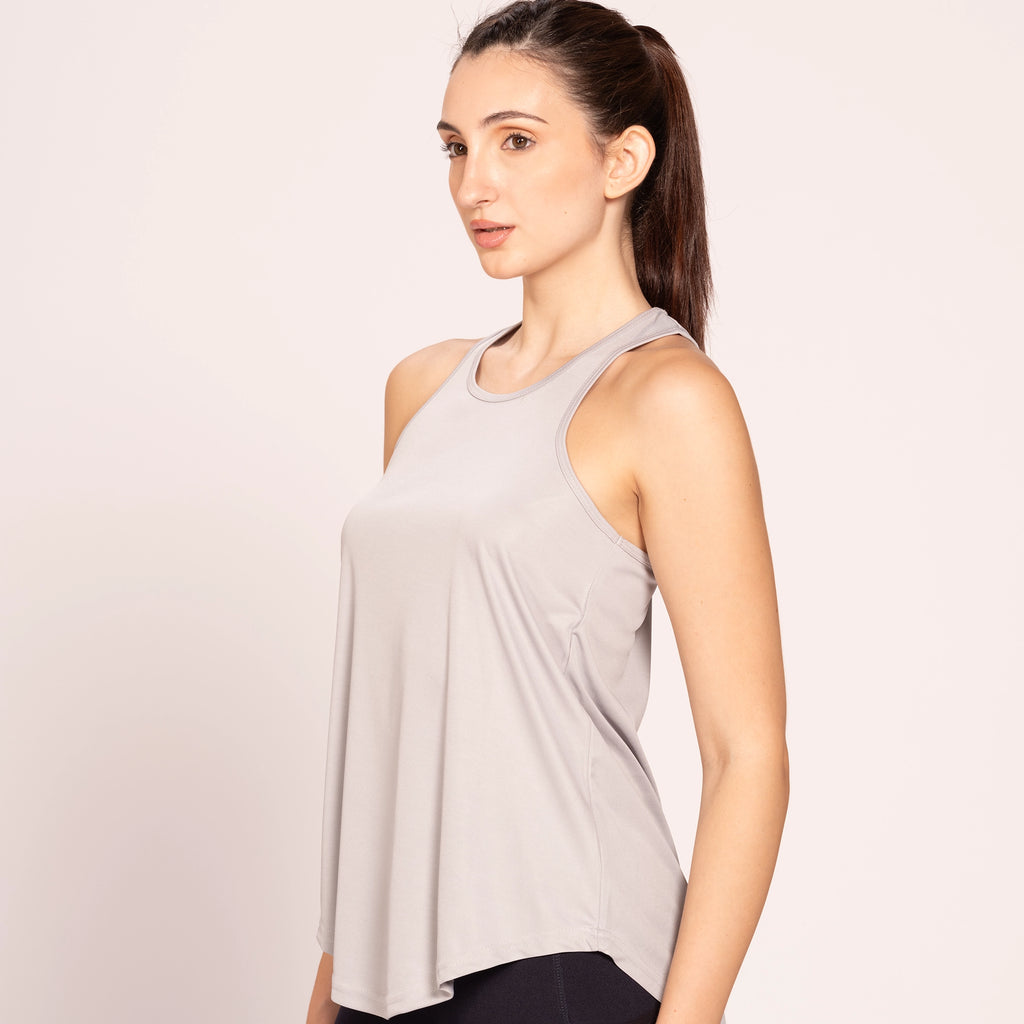 Grey activewear racerback tank top, on model, front pose — Munns & Mars