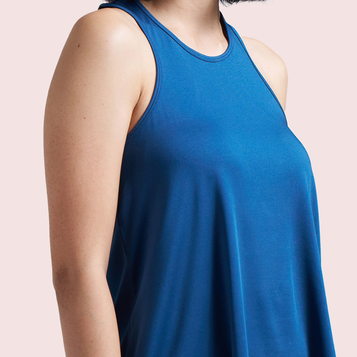 Navy Blue activewear racerback tank top, close-up of the neckline and breathable fabric — Munns & Mars
