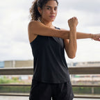 Black box-pleat active tank top, on model — Munns & Mars