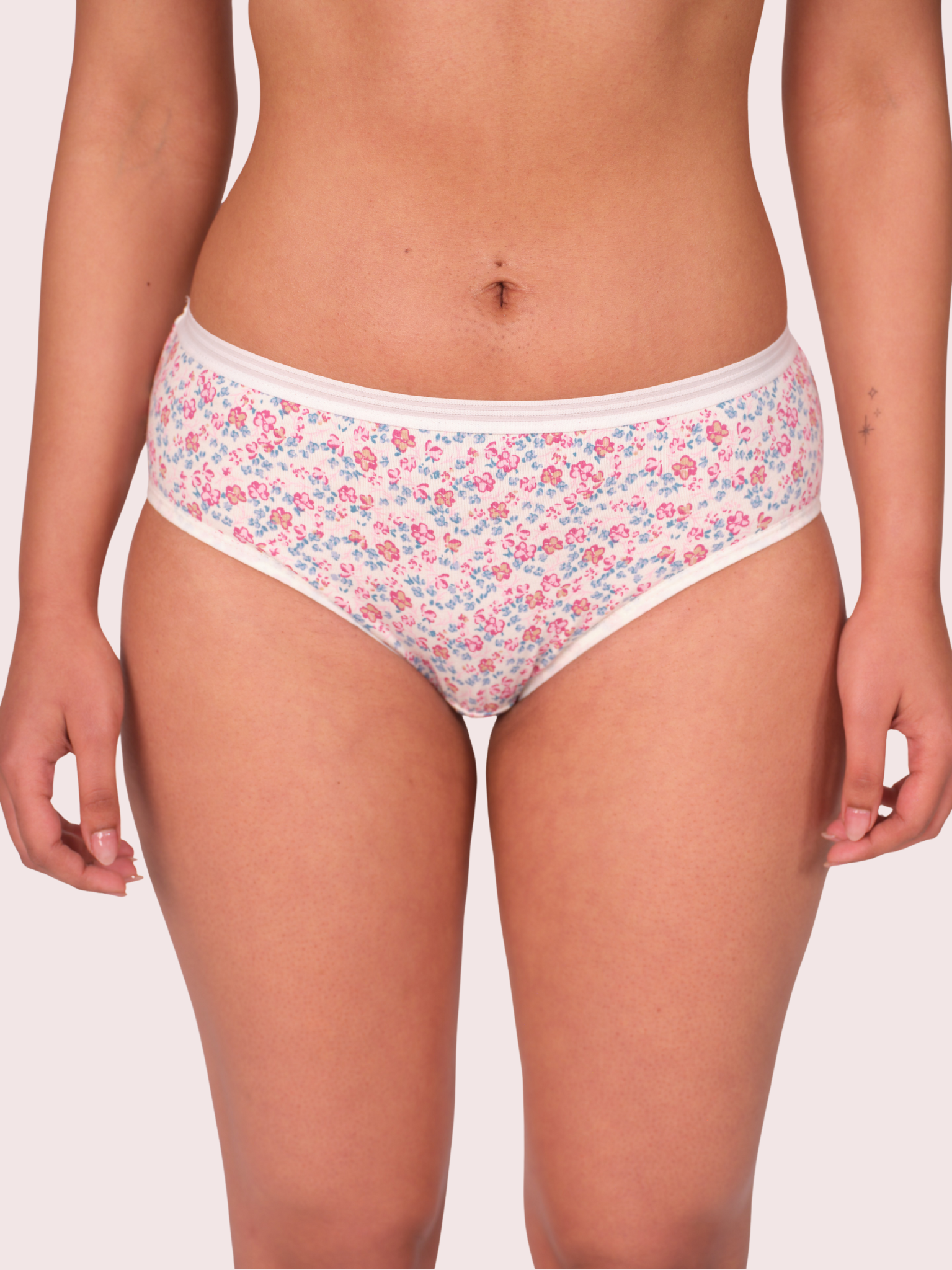 Floral-patterned underwear worn by a person on a plain background