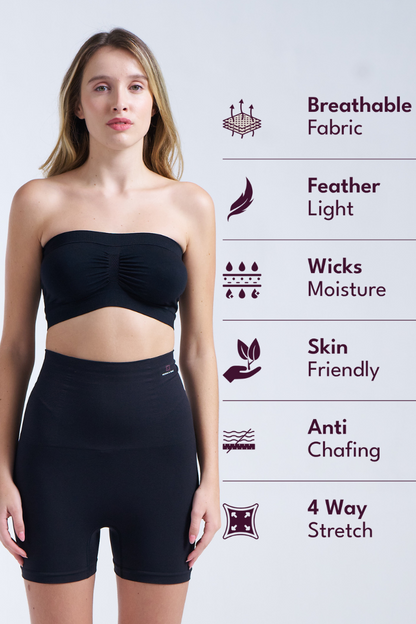 Woman wearing a black strapless top and shorts with text detailing fabric properties on a light gray background