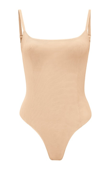 A beige colored bodysuit with a square neckline and thin straps.
