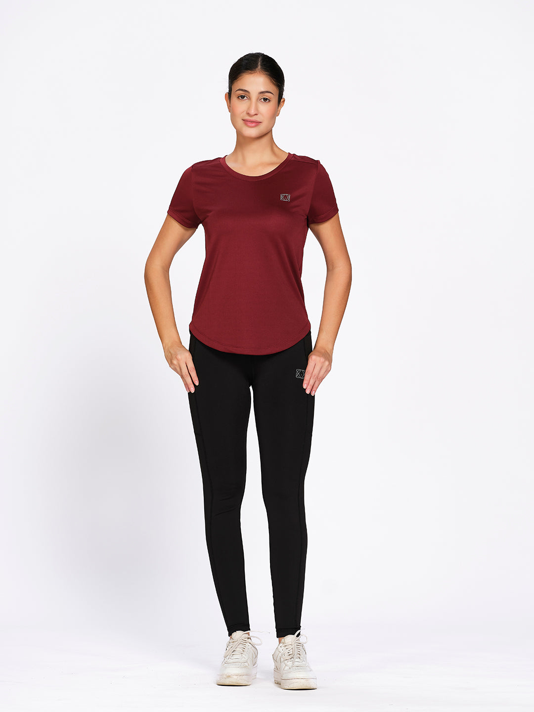 Burgundy curved hem activewear t-shirt, front full-length view on model — Munns & Mars