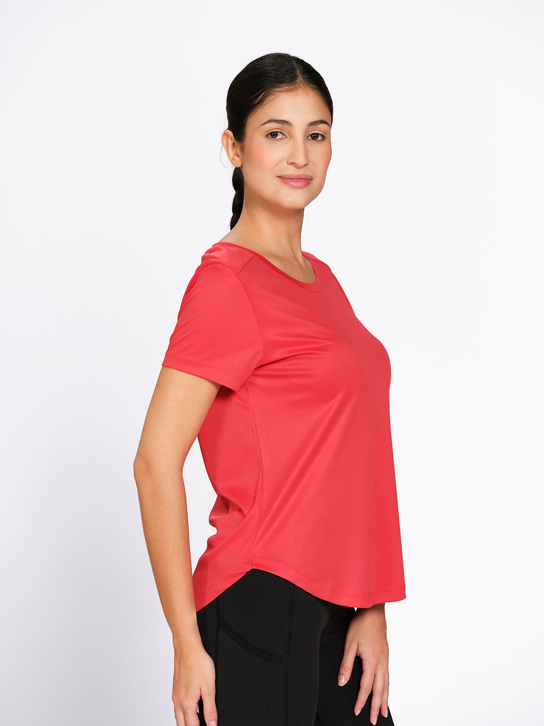 Red curved hem activewear t-shirt, front view on model showing the curved hem — Munns & Mars