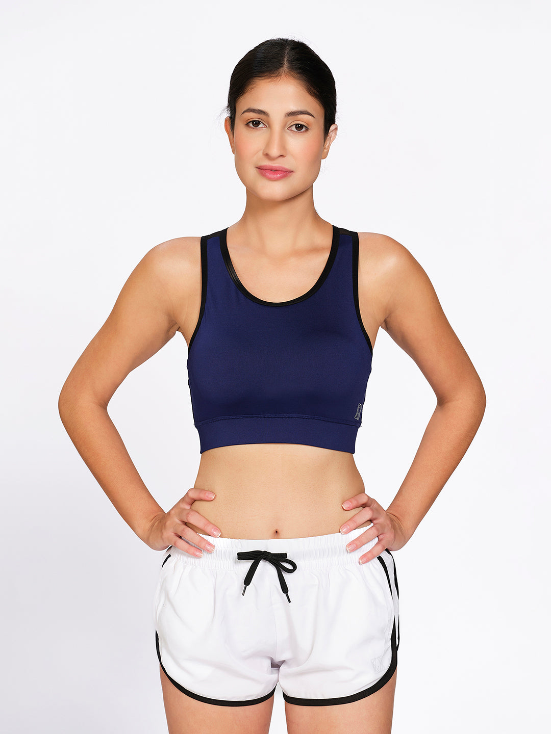 Blue padded non-wired mesh racerback sports bra, on model — Munns & Mars