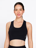 Black padded non-wired racerback sports bra, on model — Munns & Mars