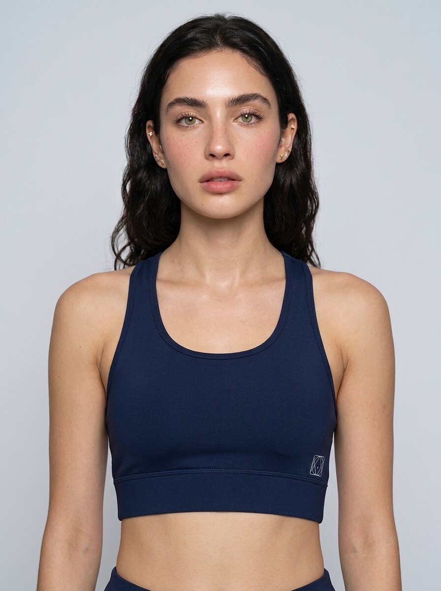 Navy Blue padded non-wired racerback sports bra, on model — Munns & Mars