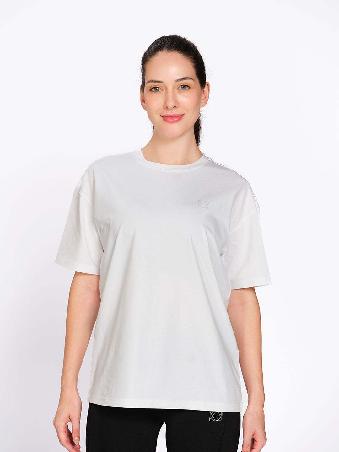 White oversized hip-length cotton-spandex t-shirt, on model — Munns & Mars