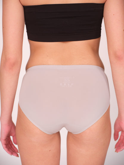 Person wearing a black tube top and light gray high-waisted underwear on a plain background